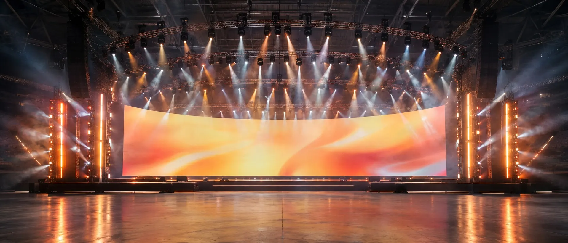 Full production rig with curved LED video wall, lighting towers and overhead truss for a Las Vegas event