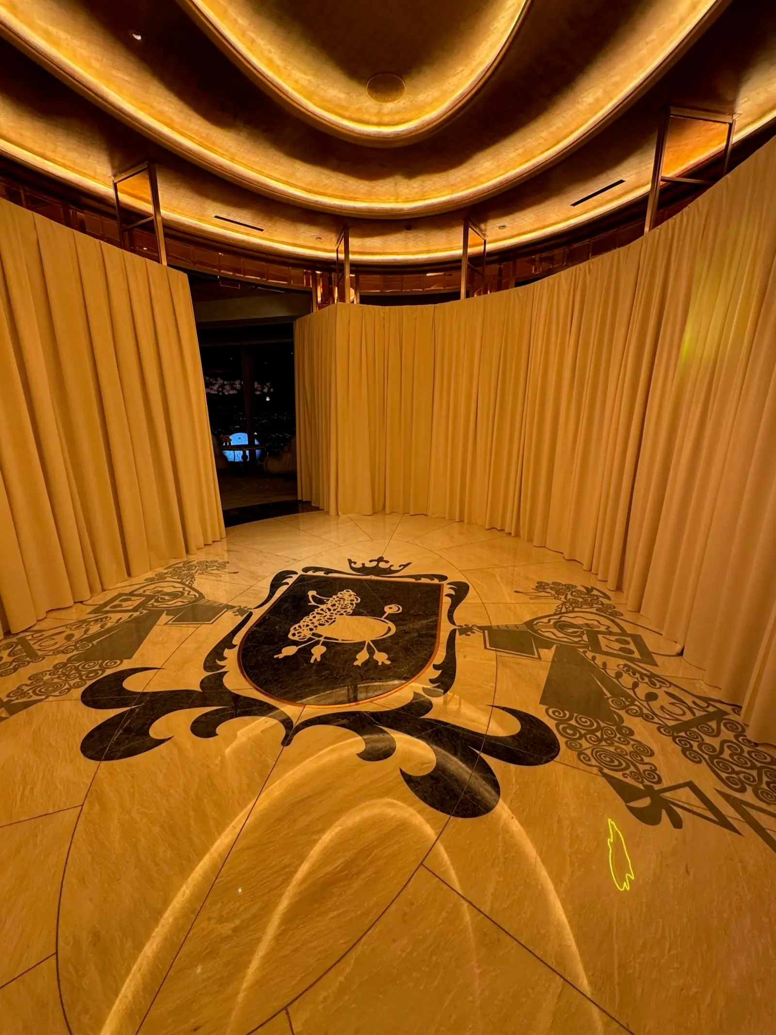 Custom draping and crest installation at luxury venue