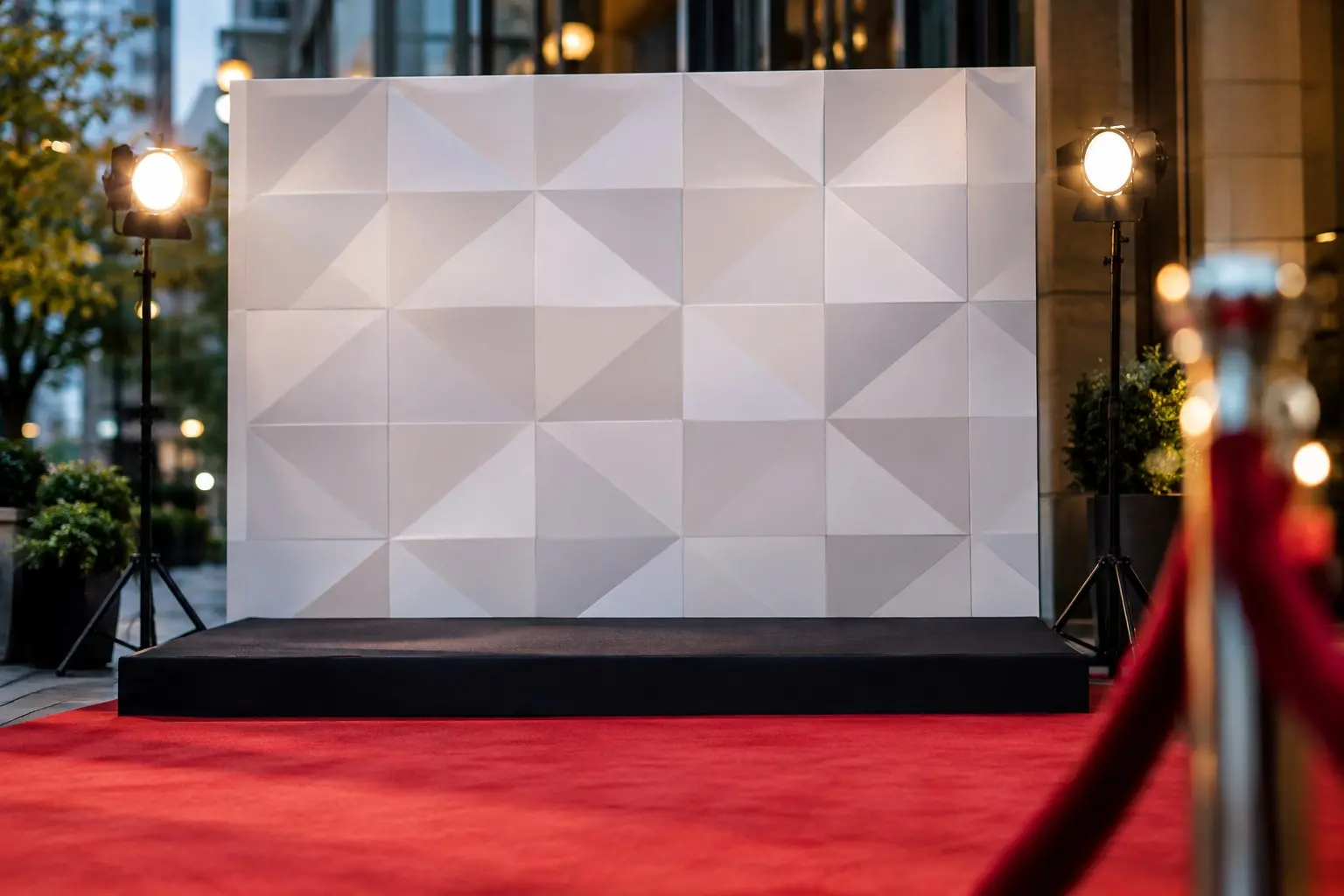 Dimensional step and repeat backdrop with red carpet and stanchions at a Las Vegas event