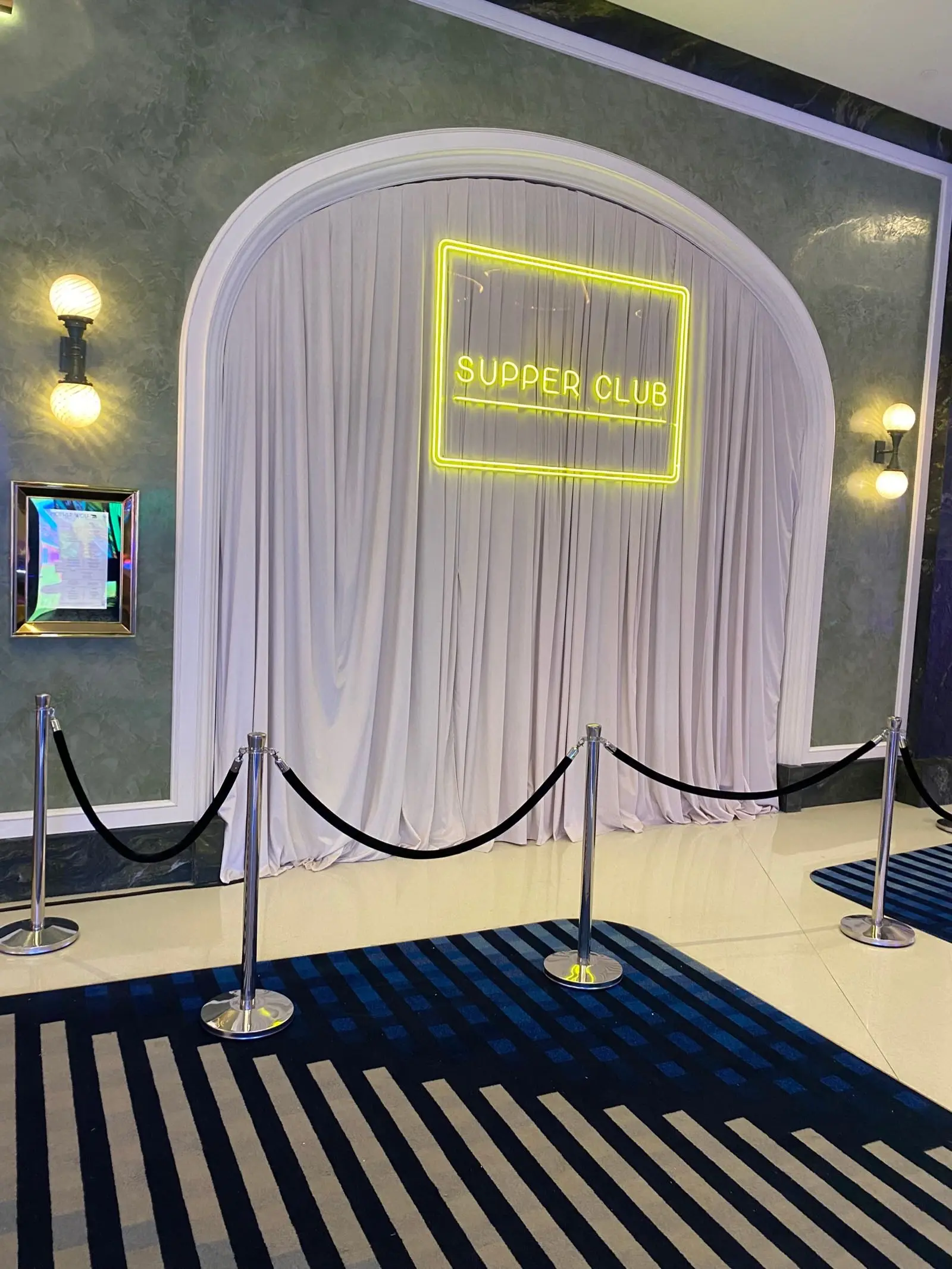 Custom Supper Club neon sign and draped arch entrance