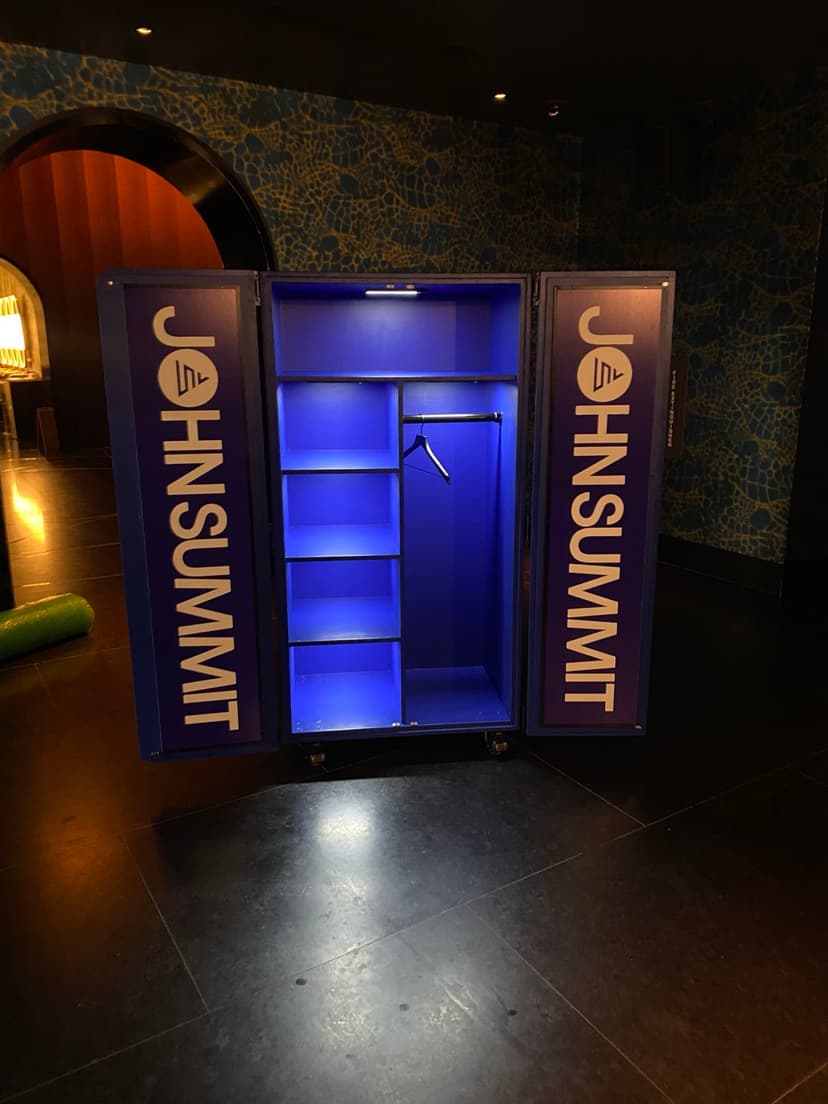 John Summit branded photo wall backdrop installation