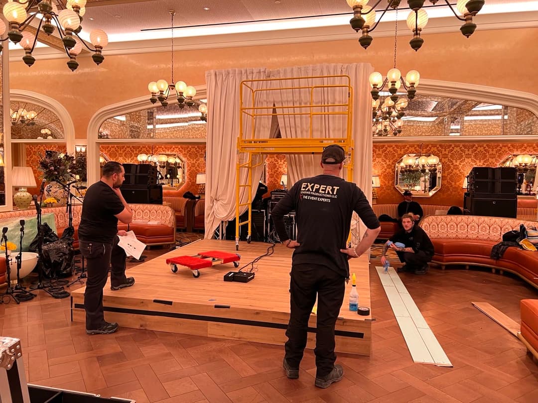 Expert Staging crew building stage at ornate Las Vegas venue