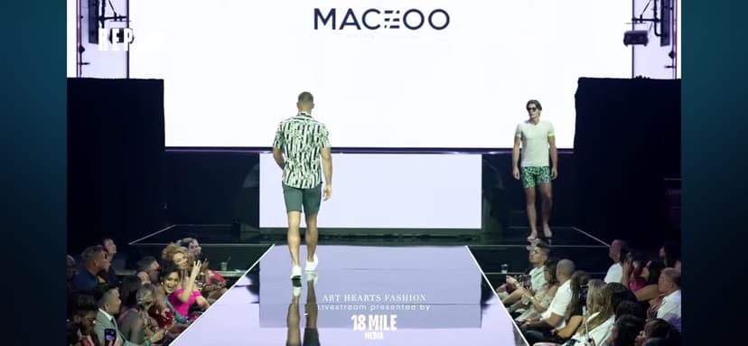 Fashion show runway production with stage and LED backdrop